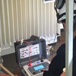 Technician with insulation tester